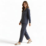 JOANNA FASHION navy blue striped floral pajama set with white piping on a smiling model against a white background