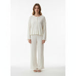 Model wearing a JOANNA FASHION off-white two-piece lounge set with a button-down top and wide-leg trousers.