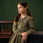JOANNA FASHION olive green long sleeve corduroy dress with a rose floral appliqué on a young girl