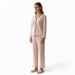 JOANNA FASHION light pink polka-dot long sleeve button-down pajama set with scalloped trim on a model
