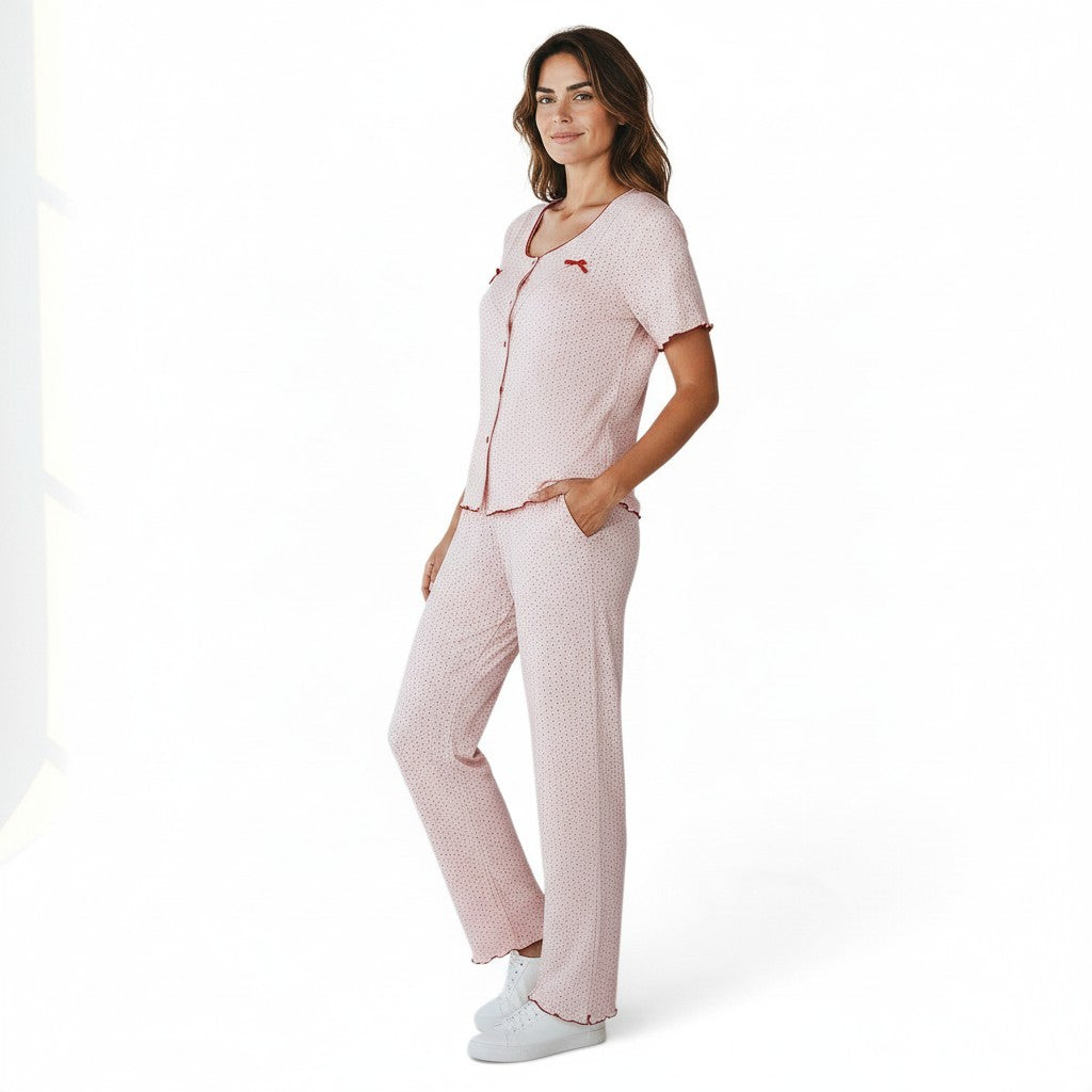 JOANNA FASHION women's pink polka dot pajama set with short sleeves, lettuce-edge trim, and bow accents on a model