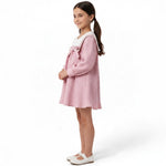 JOANNA FASHION pink textured A-line dress with white sailor collar and bow detail worn by a young girl
