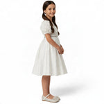 JOANNA FASHION white flower girl dress with rose-embellished bodice, puff sleeves, and rhinestone belt, side view