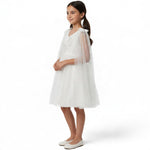 JOANNA FASHION white tulle special occasion dress with floral embroidery, beadwork, and an attached sheer cape.