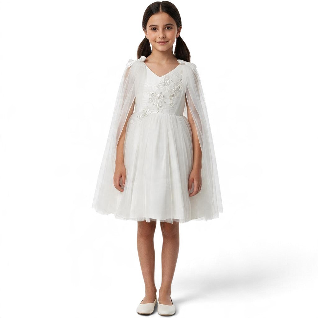 JOANNA FASHION white tulle special occasion dress with floral embroidery, beadwork, and an attached sheer cape.